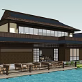 Traditional Waterfront Commercial Complex With Wooden Structure Black Roof And Outdoor Terrace Seating