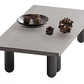 Sleek Modern Coffee Table With Black Cylindrical Legs And Decorative Pine Cones On Plate