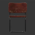 Vintage Leisure Chair With Red Worn Seat Backrest And Metal Frame Design