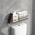 Black Metal Bathroom Shelf With Tissue Packs And Folded Towels Over White Toilet