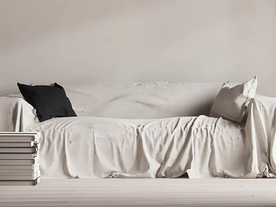 White Large Sofa With Black And Light Pillows On Wrinkled Fabric Near Stack Of Books 3d model