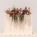 Elegant Floral Arrangement with Red Brown White Blooms and Green Foliage on Cream Curtain Backdrop