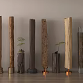 Decorative Wooden Pillars With Various Bases And Small Plants In Interior