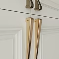Golden Cabinet Handles With Sleek Design On White Kitchen Cabinet Doors