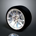 Car Wheel Rim and Tire Design Featuring Shiny Metal Details and Black Rubber