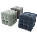 Three Square Tufted Fabric Ottomans In Different Colors For Living Room
