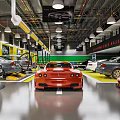 Spacious Car Dealership Showroom Featuring Various Car Models And Bright Lighting
