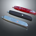 Three Utility Knives with Red Black Silver Designs and Metallic Handles