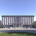 Modern Office Building With Gray Exterior Multiple Windows Front Plaza Red Flags And Surrounding Trees