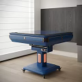 Blue Entertainment Table With Drawers On Wheels And Pink Accent In Modern Interior