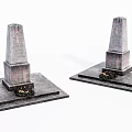 Stone and Wood Monument Structures with Square Bases and Small Flower Beds