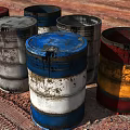Colorful Industrial Equipment Steel Drums with Oil Stains on Ground Surface