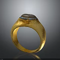 Vintage Gold Fashion Accessory Ring With Textured Band And Blue Brown Stone On Top