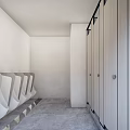 Public Toilet With Light Colored Stalls Black Frames And Modern Clean Design