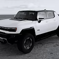 Modern White Pickup Truck With Black Accents On Sandy Terrain And Large Wheels