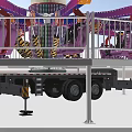 Vibrant Amusement Ride With Spinning Arms Passenger Seats Staircase And Safety Railing