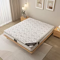 Comfortable Quilted Mattress On Wooden Frame With Nightstand Table Lamp Vase And Framed