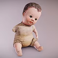 Vintage Baby Doll With Worn Cloth Outfit Sitting In Classic Pose