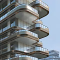 Modern High Rise Building Exterior With Curved Balconies And Glass Facade