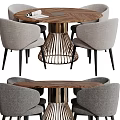 Modern Round Wooden Dining Table With Four Gray Upholstered Chairs And Metal Base