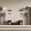Various Types of Audio Speakers Arranged on White Shelf with Light Wall Background