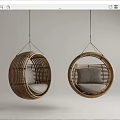 Set of Two Rattan Round Hanging Chairs With Soft Cushions In Light Background