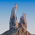 Outdoor Scenery with Towering Stone and Wood Natural Structures Under Blue Sky