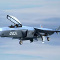 Modern Fighter Jet Flying with Numbered 2021 in Blue Sky and White Clouds