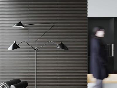 Woman in dark coat with blurry back near black floor lamp and grey striped wall 3d model