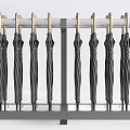 Sturdy Black Umbrellas Neatly Hung On Metal Rack For Household Use