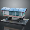 Vintage Model Caravan With Blue Roof Green Pink Stripes And Decorative Patterns On Gravel Base