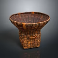 Handwoven Rattan Basket Crafted With Intricate Patterns And Functional Handle Design