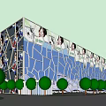 Modern Building Exterior With Blue Geometric Glass Facade Large Portraits And Green Trees