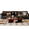 Stylish Black Leather Sofa With Decorative Cushions And Round Coffee Table Set On Geometric Rug