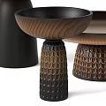 Three Elegant Wooden Coffee Tables With Textured Bases And Decorative Details