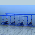 Industrial Equipment With Blue Pipes Multiple Pumps And Storage Tank Setup