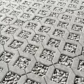 Urban Commercial Street Paved Ground With Hexagonal Concrete Grids And Small Stones