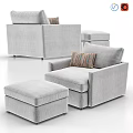 Light Gray Upholstered Lounge Chair With Matching Ottoman And Striped Decorative Pillow