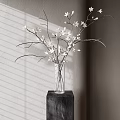 Clear Glass Vase With White Flowers On Black Base Against Window Shade Shadow Wall