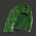 Green Sculpture Carving Featuring Fan Shaped Design With Intricate Leaf Patterns And Glossy Texture