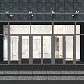 Modern Building Entrance With Glass Doors Stone Facade And Glass Canopy