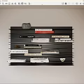 Stylish Black Layered Wall Shelf Displaying Books Magazines and Decorative Stone