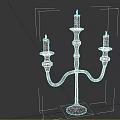 Elegant Black Candelabra Featuring Three Lit Candles And Curved Stand Design