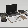 Minimalist Open Laptop Desk Setup with Notebook Pen Cactus Plant and Glass