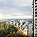Modern High Rise Residential Buildings Surrounded By Green Trees And Landscaped Areas Under Sunlit Sky
