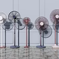 Stylish Pedestal Fans in Various Colors Standing Against Light Wall on Marble Floor