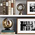 Golden Decorative Ornament Set with Sculptures Frames Books and Metal Basket on Shelf