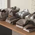 Folded Brown And White Towels In Grey Storage Baskets On Wooden Table With Wall Decor
