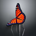 Butterfly Shaped Chair With Orange Black Wings And Metal Legs Design