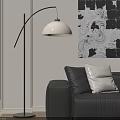Modern Arc Floor Lamp with White Shade Beside Black Leather Sofa and Abstract Wall Art